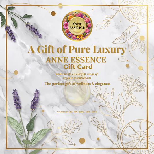 Anne Essence gift card with floral design and essential oil bottle on marble background