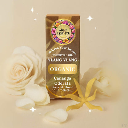 Anne Essence Organic Ylang Ylang Essential Oil box with white and yellow flowers on a soft beige background