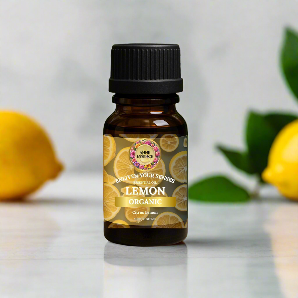 Amber glass bottle of Anne Essence Organic Lemon Essential Oil with fresh lemons and green leaves on a marble surface, luxury natural background